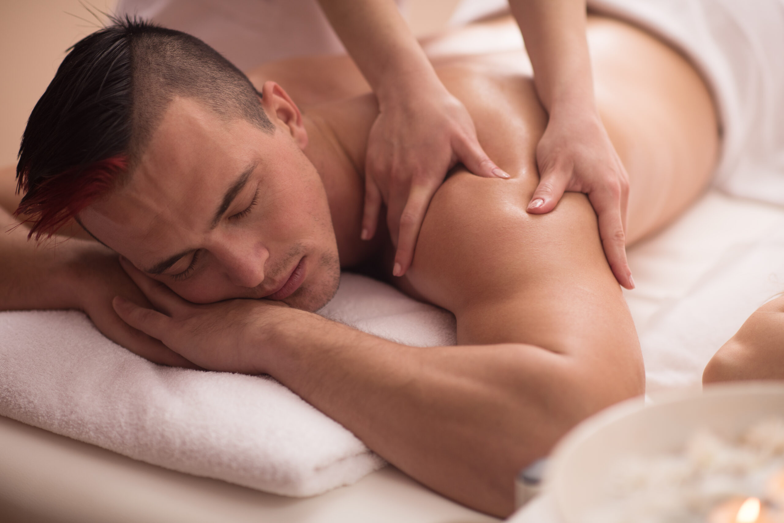 “Therapist in Hialeah performing a Swedish back massage on a client at Massage Me massage business”